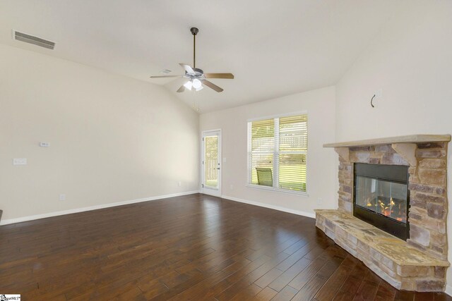 27 Dandie Dr, Simpsonville, SC 29680 - unfurnished living room featuring lofted ceiling, a stone fireplace, a ceiling fan, and dark wood-style floors