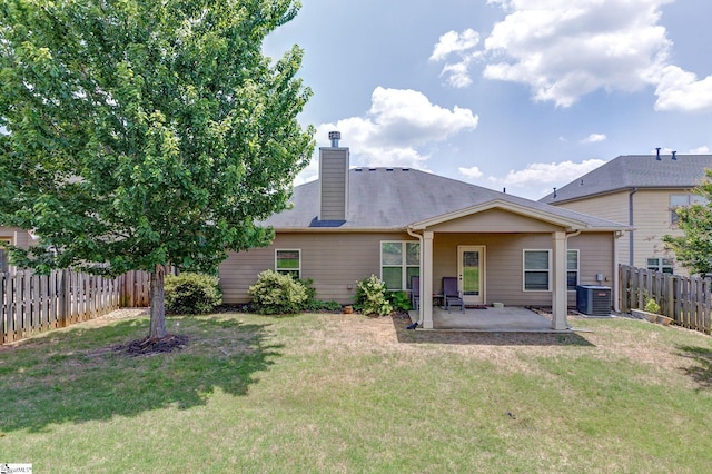 27 Dandie Dr, Simpsonville, SC 29680 - back of property featuring a patio, a fenced backyard, and a chimney