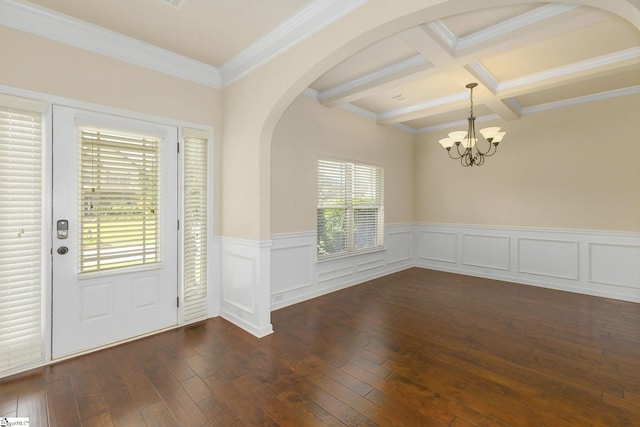 27 Dandie Dr, Simpsonville, SC 29680 - foyer entrance featuring arched walkways, beam ceiling, dark wood-style floors, a wainscoted wall, and crown molding