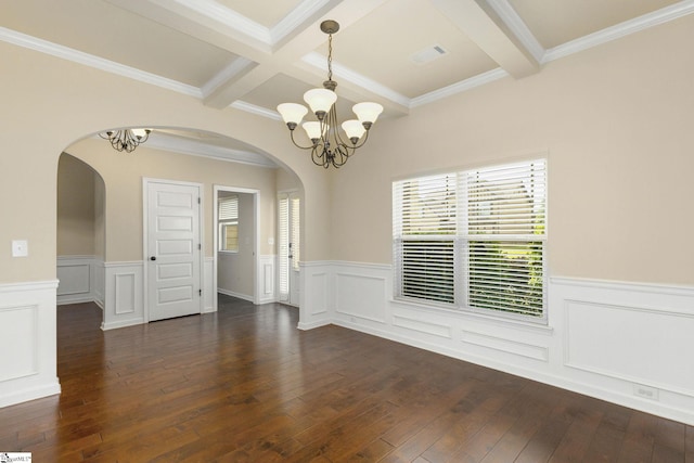 27 Dandie Dr, Simpsonville, SC 29680 - spare room with arched walkways, a chandelier, beamed ceiling, a wainscoted wall, and dark wood-type flooring