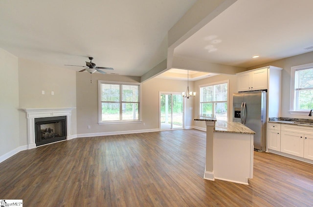 918 Belton Hwy, Williamston, SC 29691 - kitchen with stainless steel refrigerator with ice dispenser, dark wood-style flooring, light stone counters, a chandelier, and recessed lighting