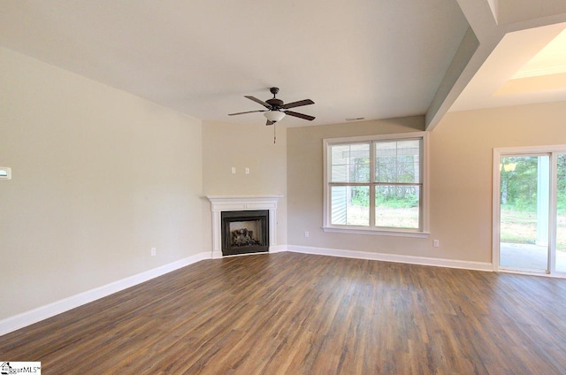 918 Belton Hwy, Williamston, SC 29691 - unfurnished living room featuring dark wood-type flooring, ceiling fan, and a fireplace
