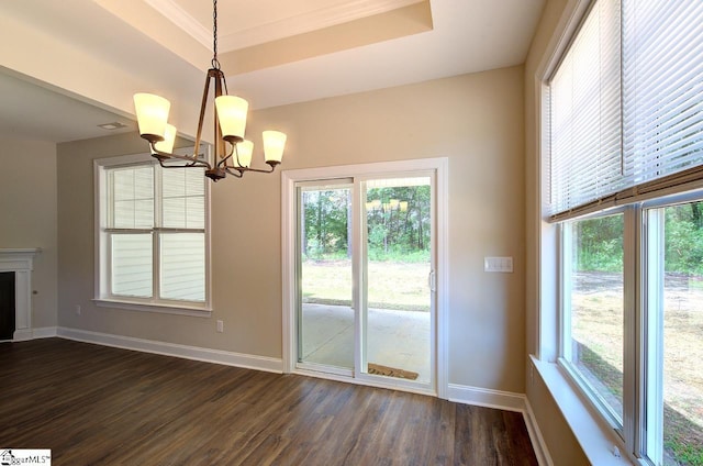 918 Belton Hwy, Williamston, SC 29691 - unfurnished dining area featuring dark wood-type flooring, a chandelier, and plenty of natural light