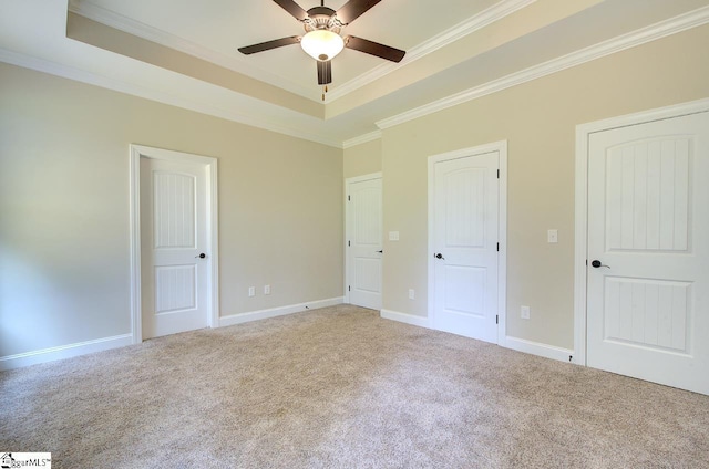 918 Belton Hwy, Williamston, SC 29691 - unfurnished bedroom featuring carpet floors, a raised ceiling, ornamental molding, and a ceiling fan