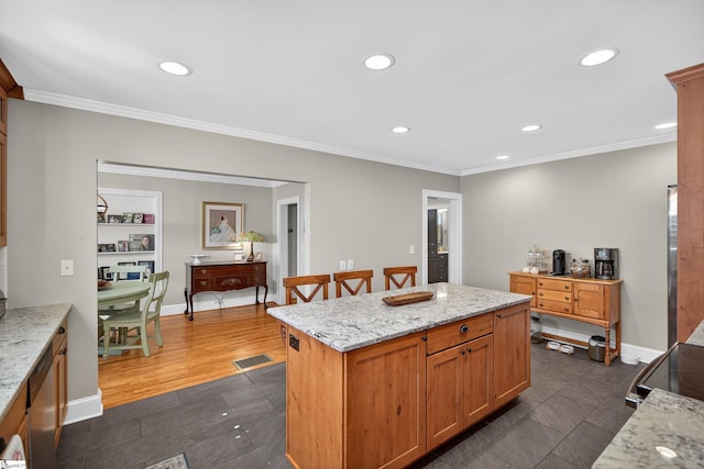 260 Riggs Dr, Clemson, SC 29631 - kitchen featuring stainless steel dishwasher, recessed lighting, crown molding, a kitchen island, and light stone counters