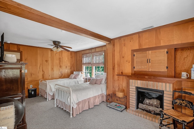 260 Riggs Dr, Clemson, SC 29631 - bedroom with beamed ceiling, wooden walls, carpet flooring, and a fireplace