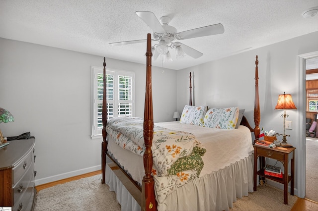260 Riggs Dr, Clemson, SC 29631 - bedroom with a textured ceiling, ceiling fan, and light wood-style floors