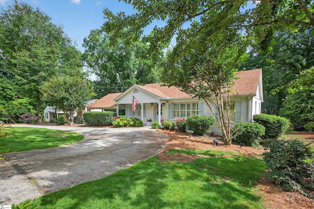 260 Riggs Dr, Clemson, SC 29631 - single story home featuring curved driveway, a front yard, covered porch, and a shingled roof