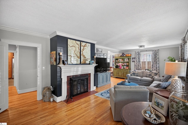 260 Riggs Dr, Clemson, SC 29631 - living area featuring a textured ceiling, a fireplace, light wood-type flooring, and ornamental molding