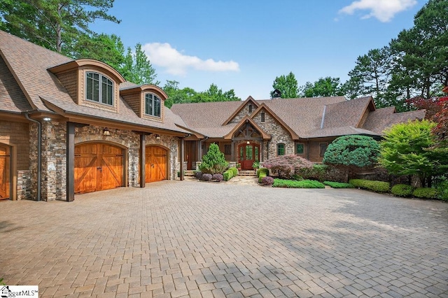 915 Rippling Water Way, Salem, SC 29676 - view of front of home featuring stone siding, an attached garage, and decorative driveway