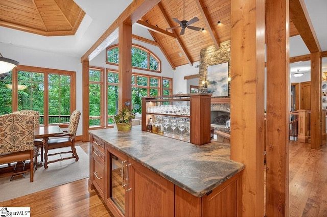 915 Rippling Water Way, Salem, SC 29676 - indoor dry bar with light wood-style floors, a wood ceiling with exposed beams, beverage cooler, a ceiling fan, and high vaulted ceiling