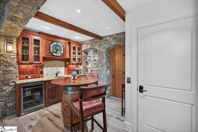 915 Rippling Water Way, Salem, SC 29676 - indoor wet bar with beverage cooler, beam ceiling, light wood-style flooring, and tasteful backsplash