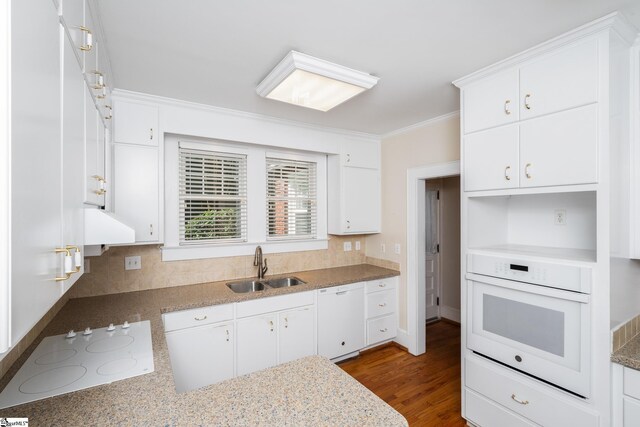 306 Mcdaniel Ave, Greenville, SC 29601 - kitchen with white appliances, ornamental molding, white cabinetry, and decorative backsplash
