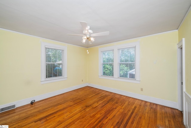 306 Mcdaniel Ave, Greenville, SC 29601 - unfurnished room featuring wood-type flooring, plenty of natural light, a ceiling fan, and crown molding