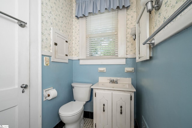 306 Mcdaniel Ave, Greenville, SC 29601 - half bathroom featuring vanity and wallpapered walls