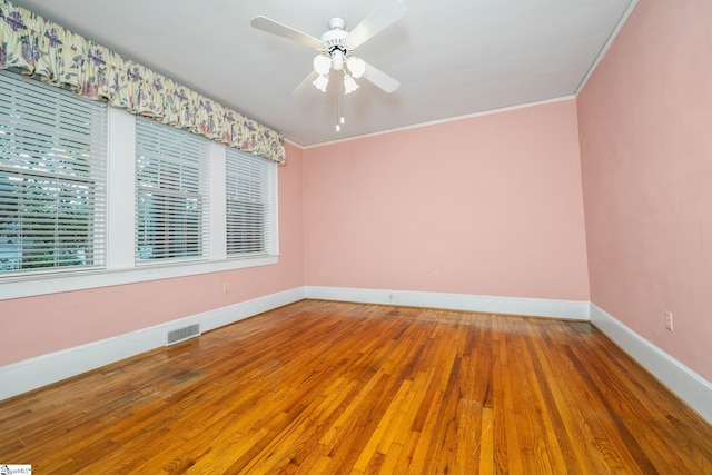 306 Mcdaniel Ave, Greenville, SC 29601 - spare room with wood finished floors, crown molding, and a ceiling fan