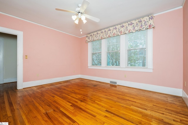 306 Mcdaniel Ave, Greenville, SC 29601 - empty room with crown molding, hardwood / wood-style floors, and a ceiling fan