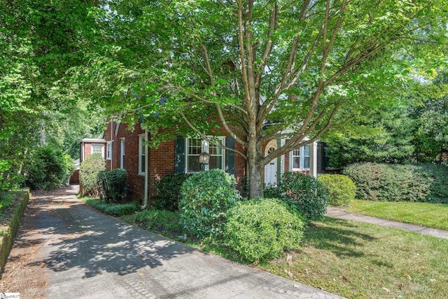 306 Mcdaniel Ave, Greenville, SC 29601 - obstructed view of property with brick siding and driveway