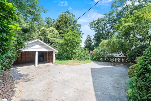 306 Mcdaniel Ave, Greenville, SC 29601 - garage featuring concrete driveway and a carport
