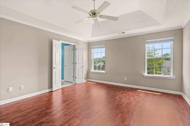 323 Waterton Way, Simpsonville, SC 29680 - unfurnished room featuring healthy amount of natural light, a raised ceiling, wood finished floors, and crown molding