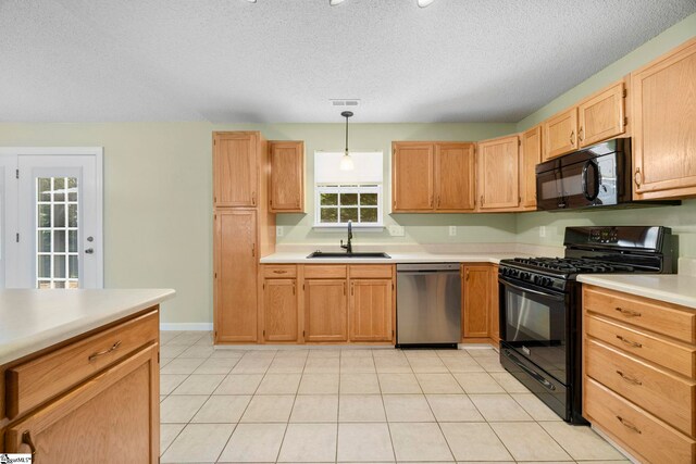 210 Admiral Ln, Greer, SC 29650 - kitchen featuring black appliances, light countertops, a textured ceiling, hanging light fixtures, and light tile patterned floors