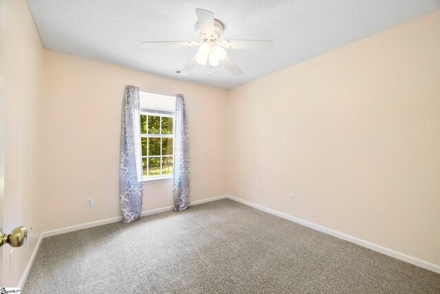 210 Admiral Ln, Greer, SC 29650 - spare room featuring carpet floors, a ceiling fan, and a textured ceiling