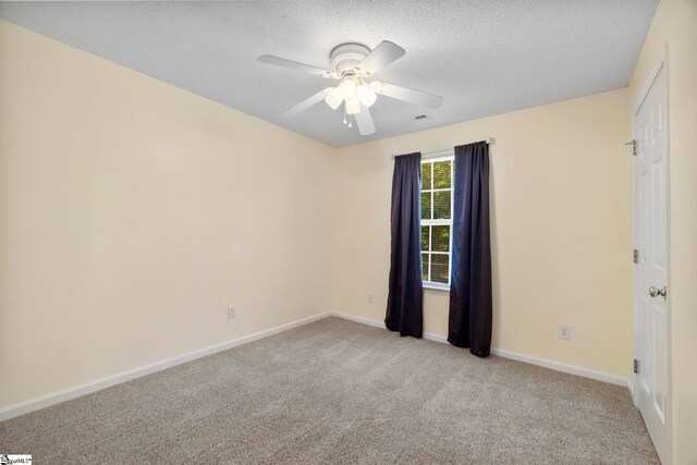 210 Admiral Ln, Greer, SC 29650 - spare room with light colored carpet, a ceiling fan, and a textured ceiling