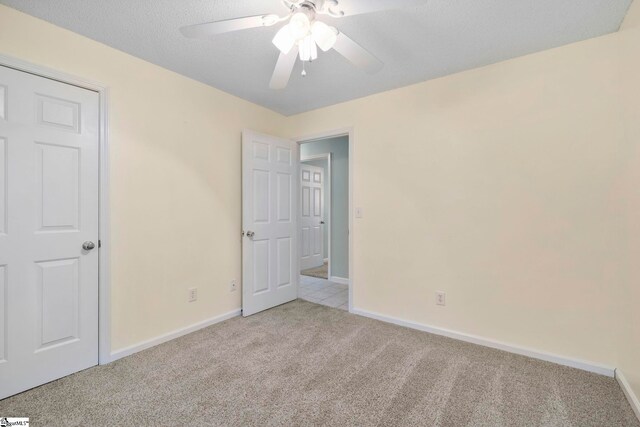 210 Admiral Ln, Greer, SC 29650 - unfurnished bedroom featuring light carpet and a ceiling fan