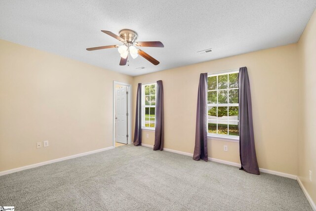 210 Admiral Ln, Greer, SC 29650 - spare room with carpet floors, a ceiling fan, and a textured ceiling