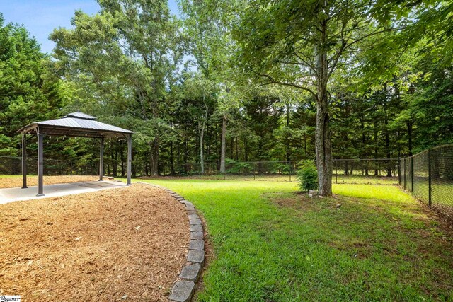 210 Admiral Ln, Greer, SC 29650 - fenced backyard with a gazebo and a patio area