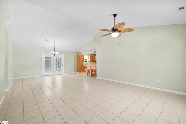 210 Admiral Ln, Greer, SC 29650 - unfurnished living room featuring a ceiling fan, light tile patterned flooring, high vaulted ceiling, and a chandelier