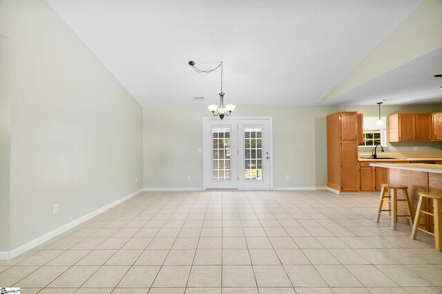 210 Admiral Ln, Greer, SC 29650 - unfurnished living room featuring vaulted ceiling, a chandelier, and light tile patterned floors
