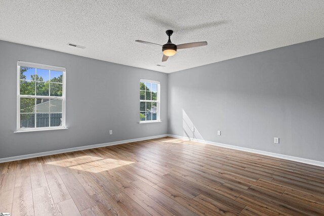 29 Parkgate Ct, Simpsonville, SC 29680 - unfurnished room with hardwood / wood-style flooring, a textured ceiling, and a ceiling fan