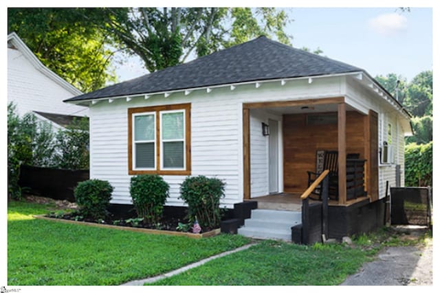 119 Trussell St, Honea Path, SC 29654 - bungalow with a shingled roof, a front yard, and a porch