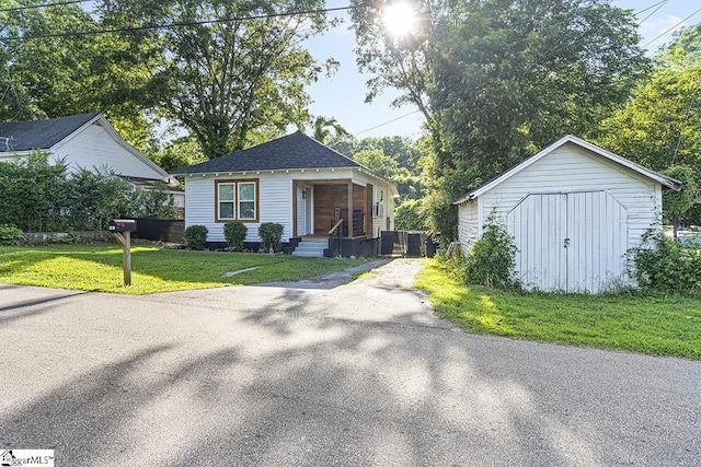 119 Trussell St, Honea Path, SC 29654 - view of front of property with a front yard and a storage shed