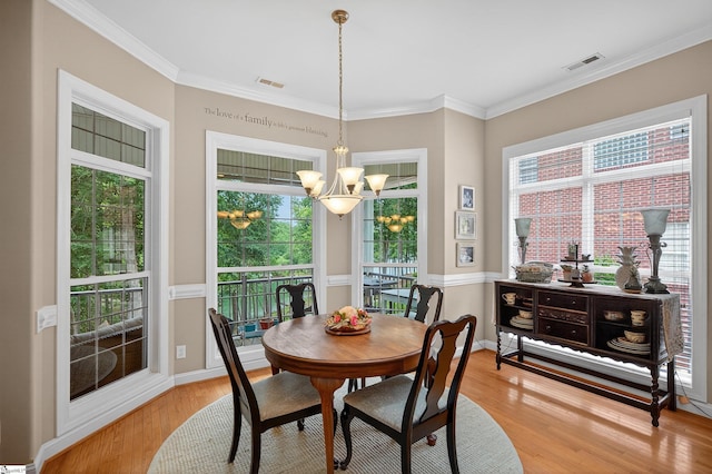 109 Tall Ship Dr, Anderson, SC 29625 - dining area featuring a chandelier, light wood finished floors, and crown molding