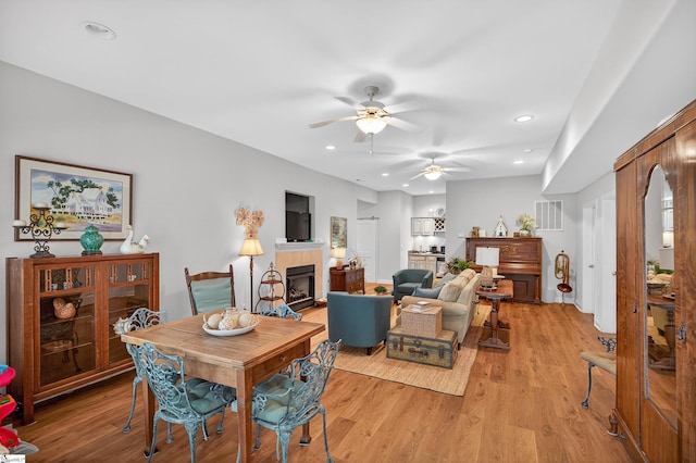 109 Tall Ship Dr, Anderson, SC 29625 - dining area with ceiling fan, a tile fireplace, light wood finished floors, and recessed lighting