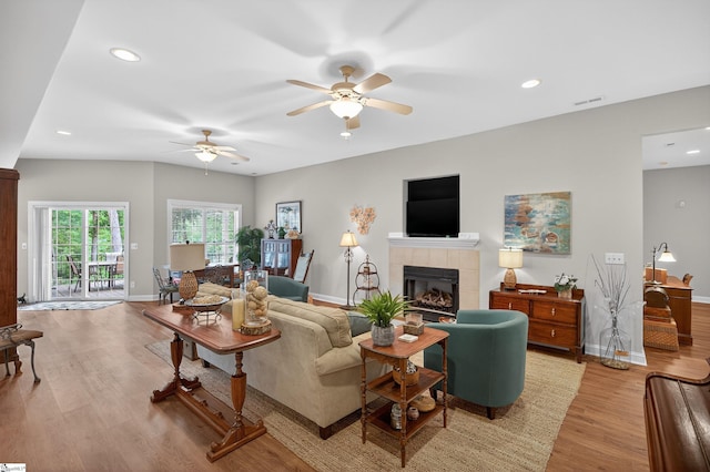 109 Tall Ship Dr, Anderson, SC 29625 - living area featuring light wood-style flooring, a ceiling fan, a tiled fireplace, and recessed lighting