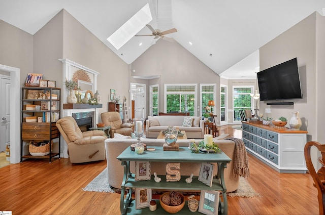 109 Tall Ship Dr, Anderson, SC 29625 - living room with high vaulted ceiling, a fireplace, a ceiling fan, light wood-style floors, and a skylight