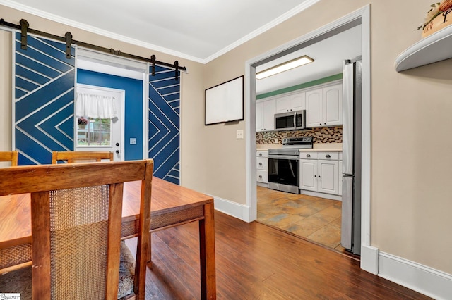 226 Mariposa Cir, Anderson, SC 29621 - foyer with a barn door, dark wood-type flooring, and ornamental molding