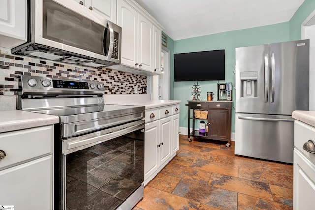 226 Mariposa Cir, Anderson, SC 29621 - kitchen featuring appliances with stainless steel finishes, stone tile floors, backsplash, and light countertops