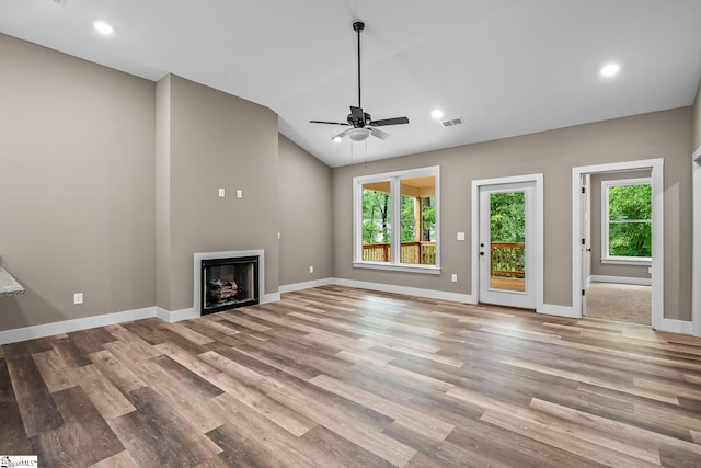 156 Grand Oak Cir, Pendleton, SC 29670 - unfurnished living room featuring healthy amount of natural light, a fireplace, wood finished floors, lofted ceiling, and recessed lighting