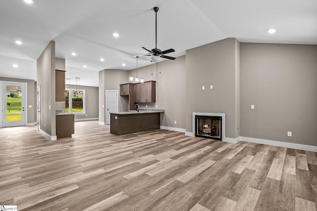 156 Grand Oak Cir, Pendleton, SC 29670 - unfurnished living room featuring a ceiling fan, light wood-style flooring, recessed lighting, vaulted ceiling, and a fireplace
