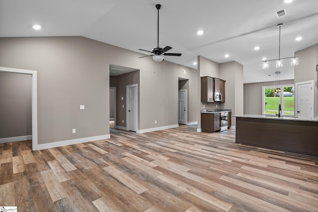 156 Grand Oak Cir, Pendleton, SC 29670 - unfurnished living room featuring light wood-style floors, vaulted ceiling, a ceiling fan, and recessed lighting