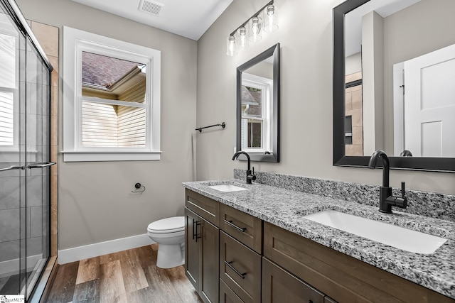 156 Grand Oak Cir, Pendleton, SC 29670 - bathroom featuring plenty of natural light, double vanity, tiled shower, and wood finished floors