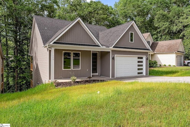 156 Grand Oak Cir, Pendleton, SC 29670 - view of front of property featuring a porch, a garage, a shingled roof, and a front yard