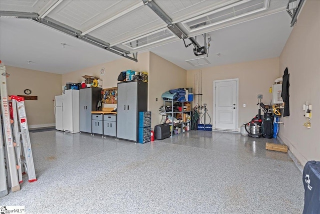 228 Holstein Ct, Fountain Inn, SC 29644 - garage featuring a garage door opener and baseboards