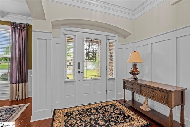 228 Holstein Ct, Fountain Inn, SC 29644 - entrance foyer with a decorative wall, crown molding, wainscoting, and wood finished floors