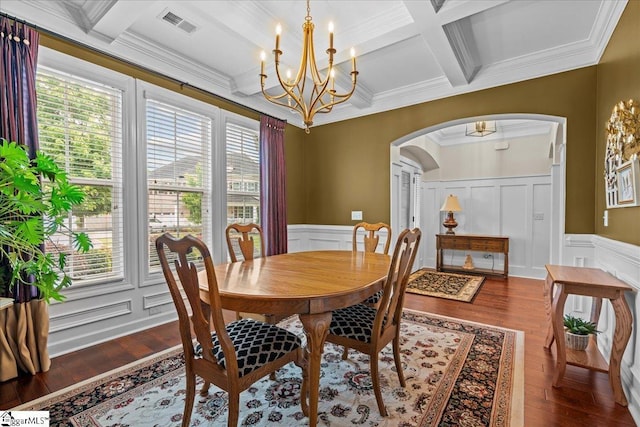 228 Holstein Ct, Fountain Inn, SC 29644 - dining room featuring arched walkways, coffered ceiling, a chandelier, healthy amount of natural light, and a decorative wall