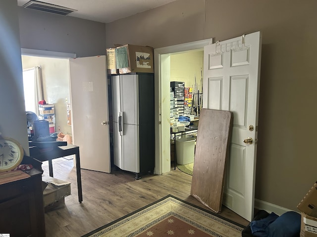 101 Elm St, Clinton, SC 29325 - kitchen with wood finished floors and stainless steel fridge